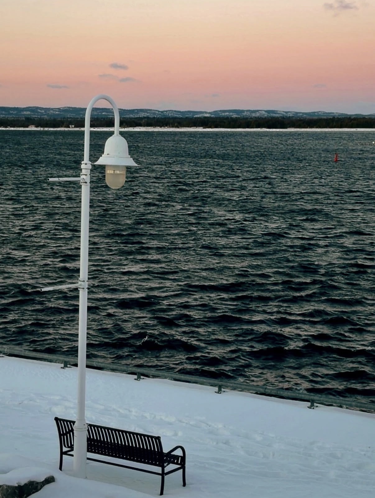 A bench on the Little Current boardwalk in the winter